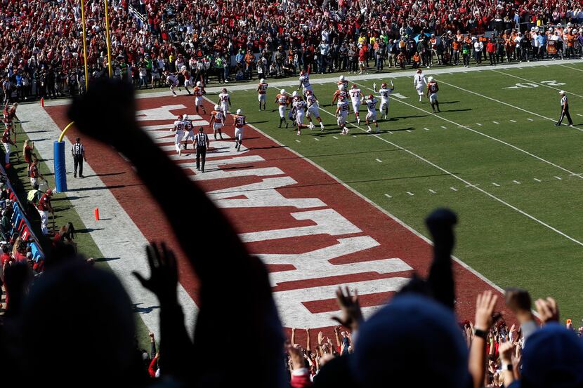 Oklahoma Sooners fans celebrate as Oklahoma Sooners scores on their opening drive against...