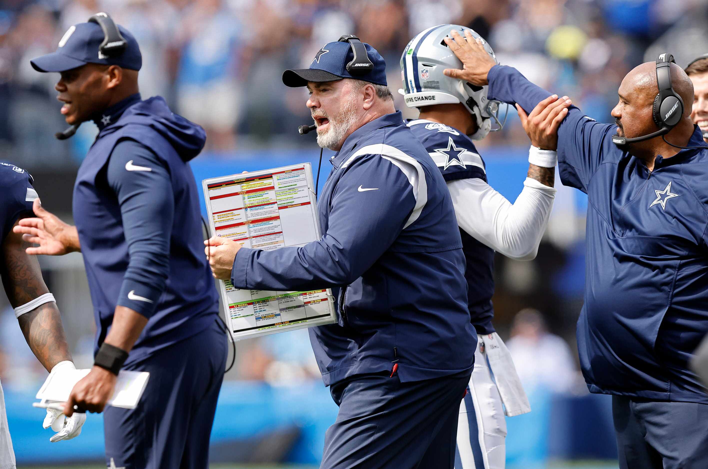 Dallas Cowboys head coach Mike McCarthy cheers after Ezekiel Elliott's first half touchdown...
