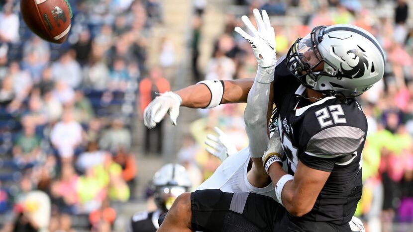 Denton Guyer's Peyton Bowen (22) breaks up a pass intended for Prosper's Houston Hawkins (4)...