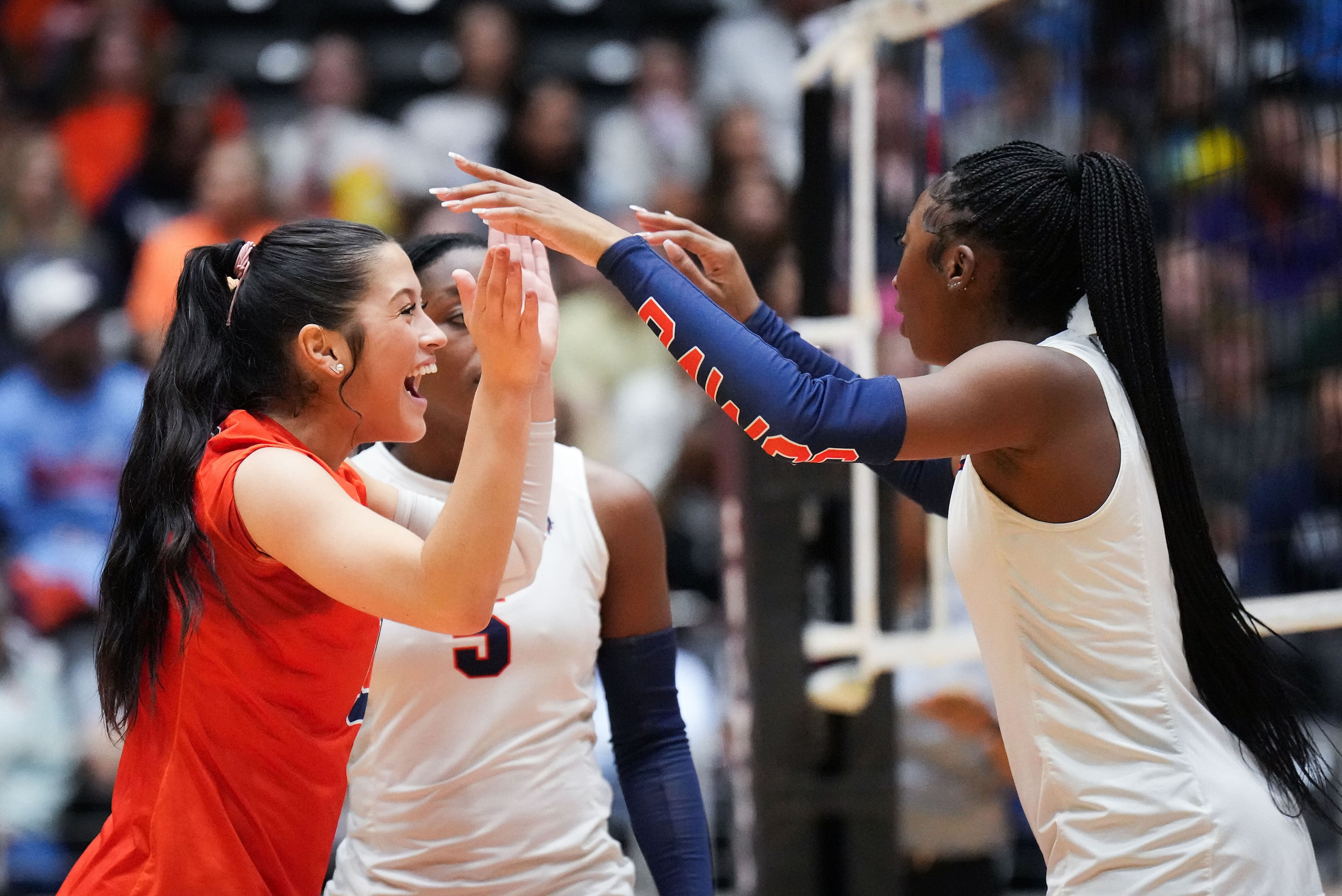 McKinney North's Gabi Rodriguez (left) celebrates a point with Kaitlyn Jefferson during the...