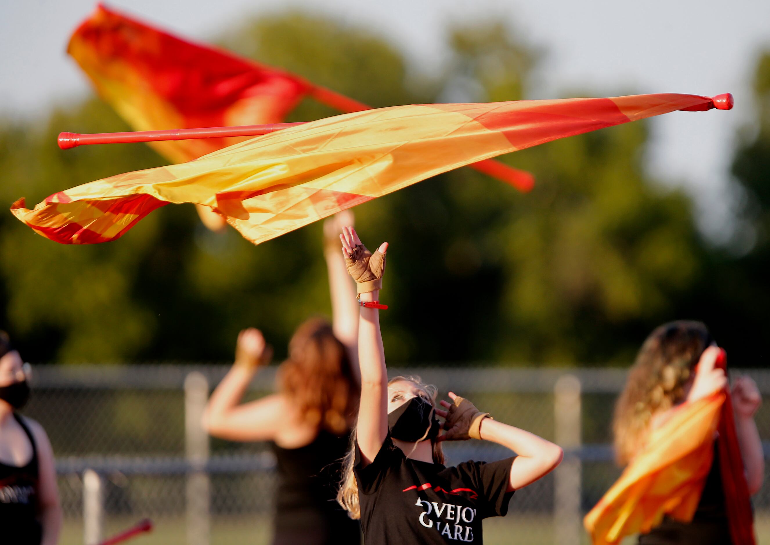 Hannah Stout, 15, of the Lovejoy High School Color Guard, practices her routine before...