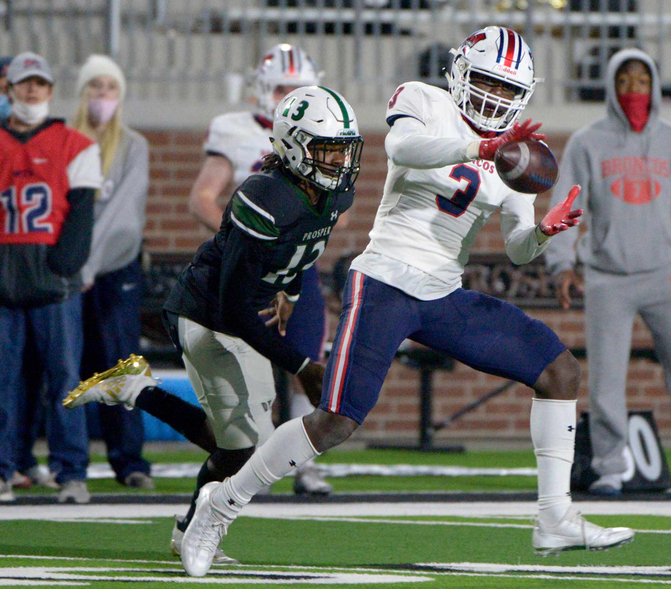 McKinney Boyd’s Dominique Stevenson (3) catches a pass in front of Prosper’s Kaleb Miles in...