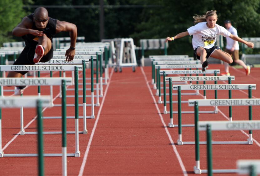 Emmanuel Aouad, 24, left, races against time over hurdles along with other competitors...