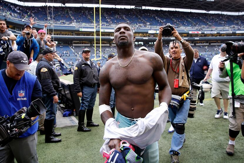 Dallas Cowboys wide receiver Dez Bryant (88) traded his jersey to a Seattle Seahawks player...