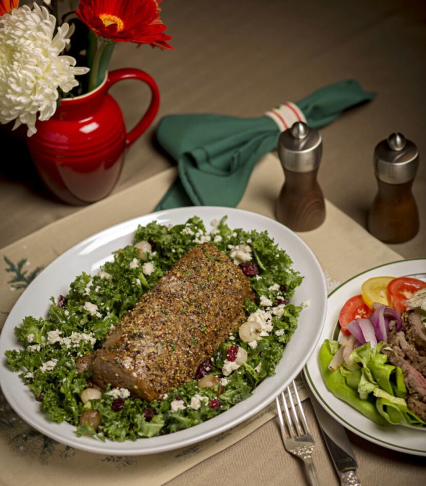 A chateaubriand cut beef tenderloin wit kale salad, shot Monday, October 28, 2013 at the...