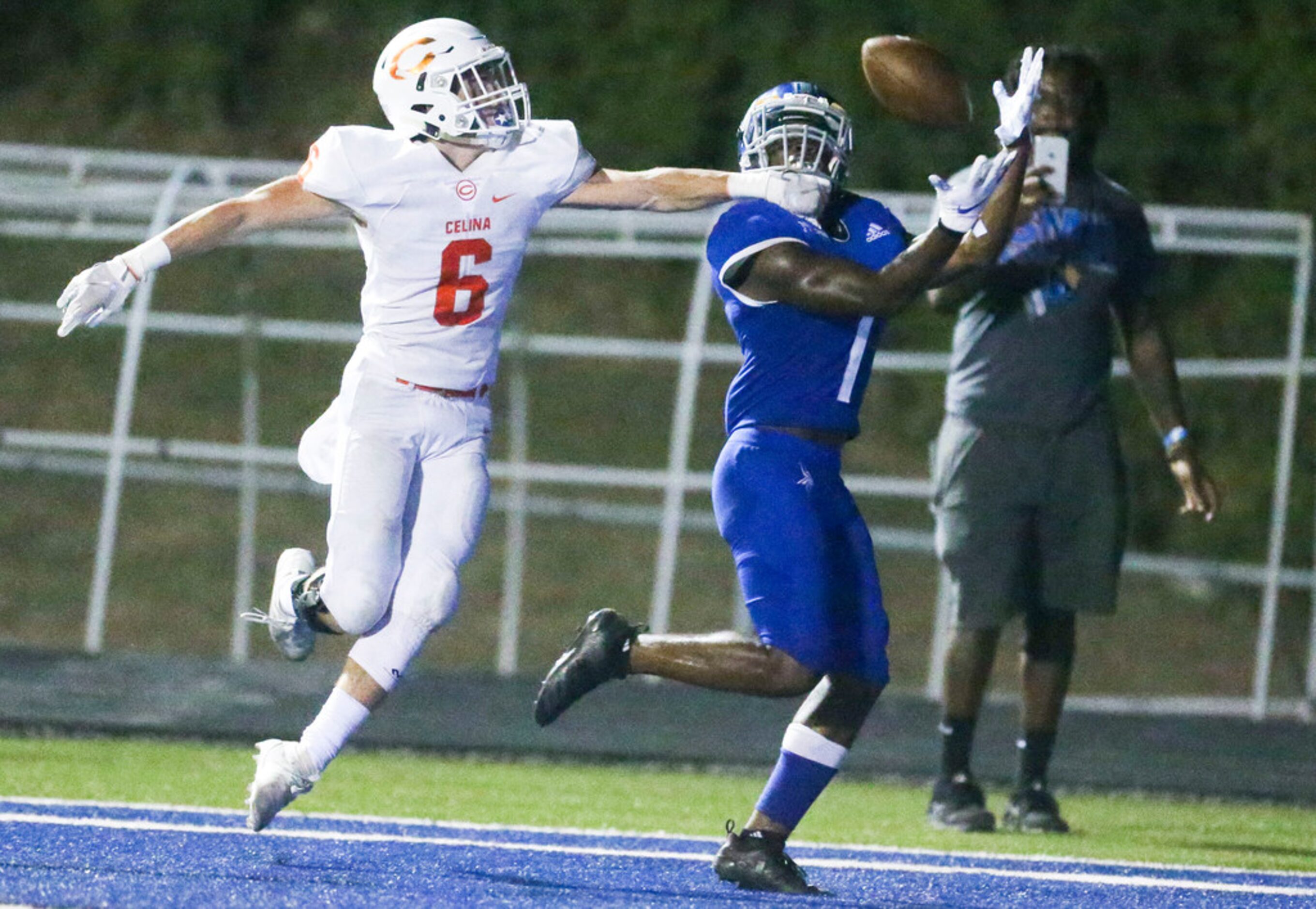 Nolan Catholic wide receiver Brandon Chatman (1) hauls in a pass for a touchdown as he is...