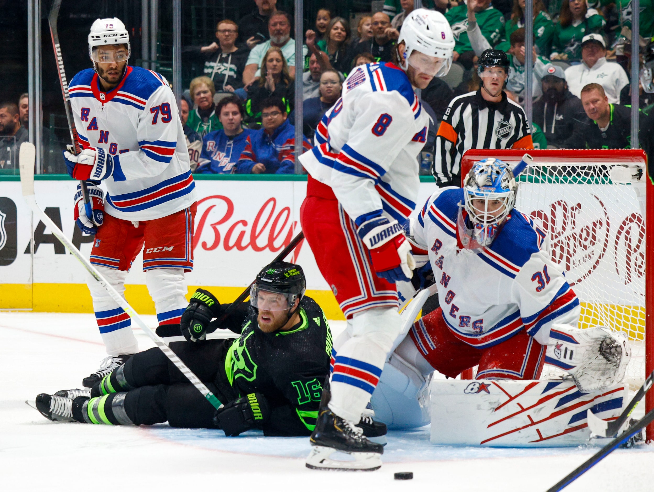 Dallas Stars center Joe Pavelski (16) falls to the ic e in the crease alongside New York...