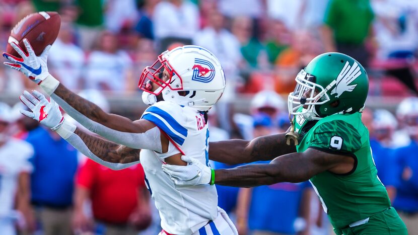 SMU wide receiver Reggie Roberson Jr. (8) has a pass go off his fingers as UNT defensive...