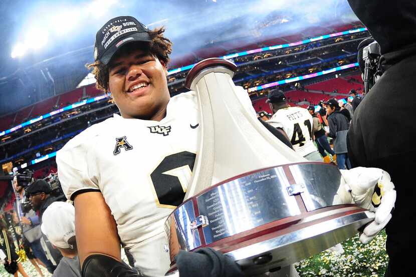 ATLANTA, GA - JANUARY 1: Trysten Hill #9 of the Central Florida Knights celebrates after the...