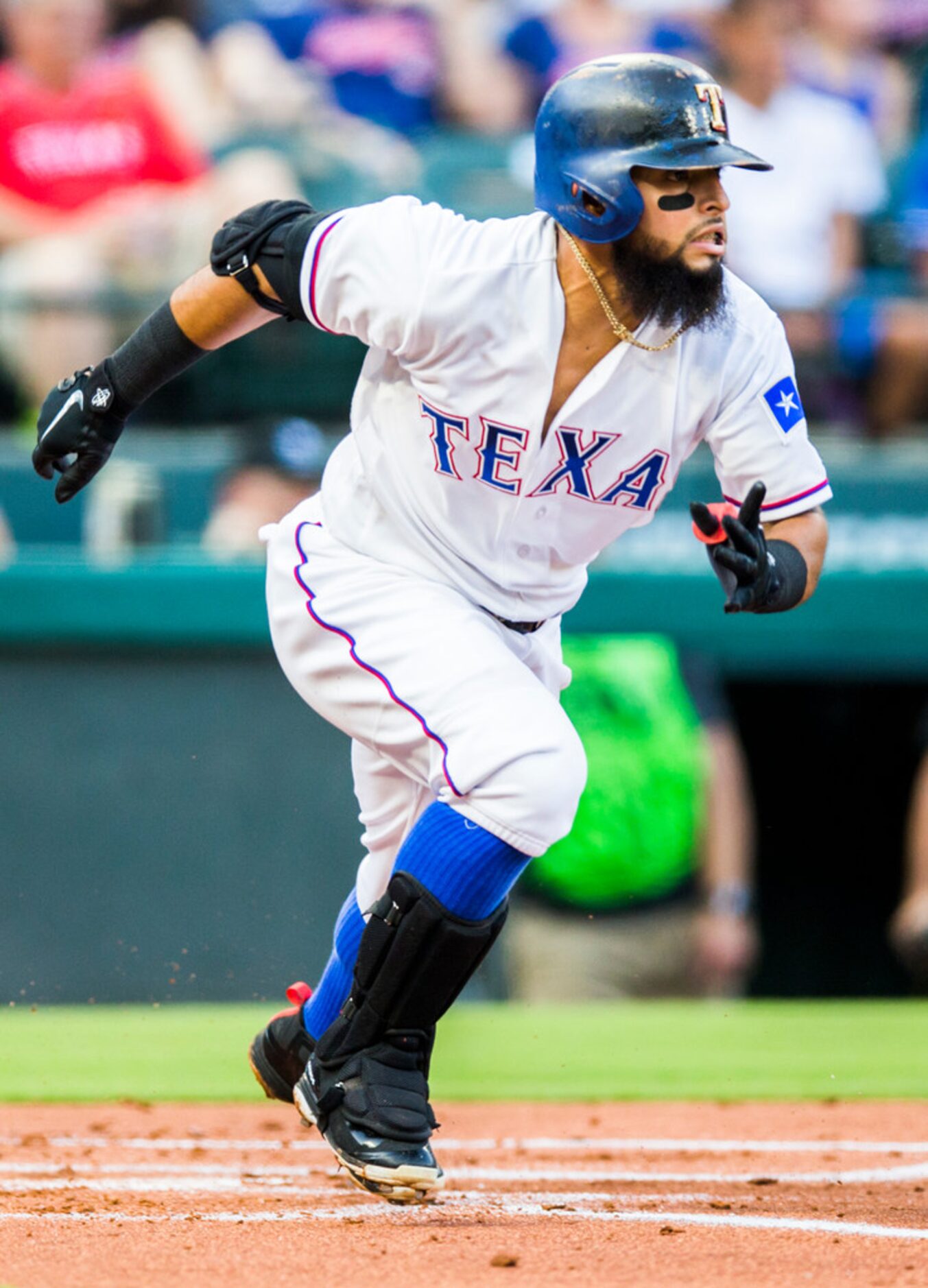 Texas Rangers second baseman Rougned Odor (12) runs to first after hitting a single during...