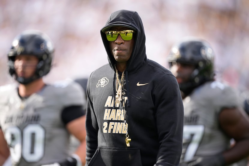 Colorado head coach Deion Sanders heads into the lockerroom after players warmed up before...