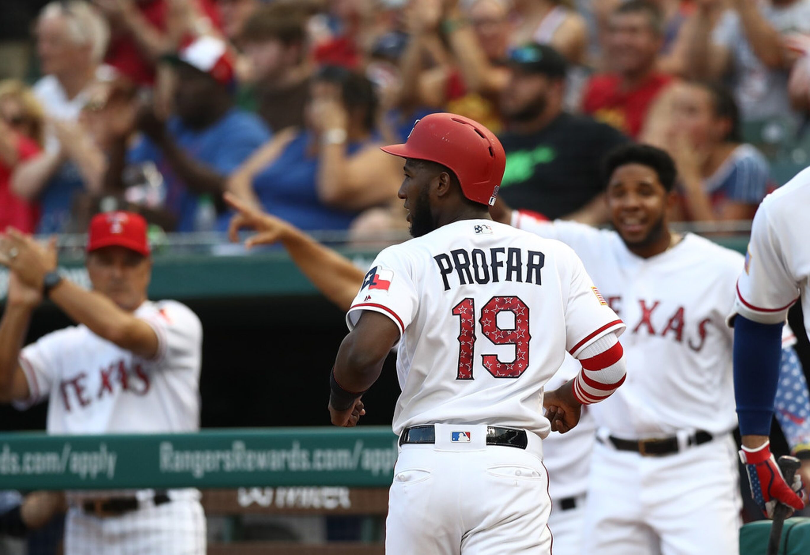 ARLINGTON, TX - JULY 04:  Jurickson Profar #19 of the Texas Rangers scores a run against the...