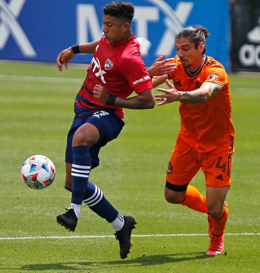 FC Dallas midfielder Freddy Vargas (17) makes a pass in front of Houston Dynamo defender...