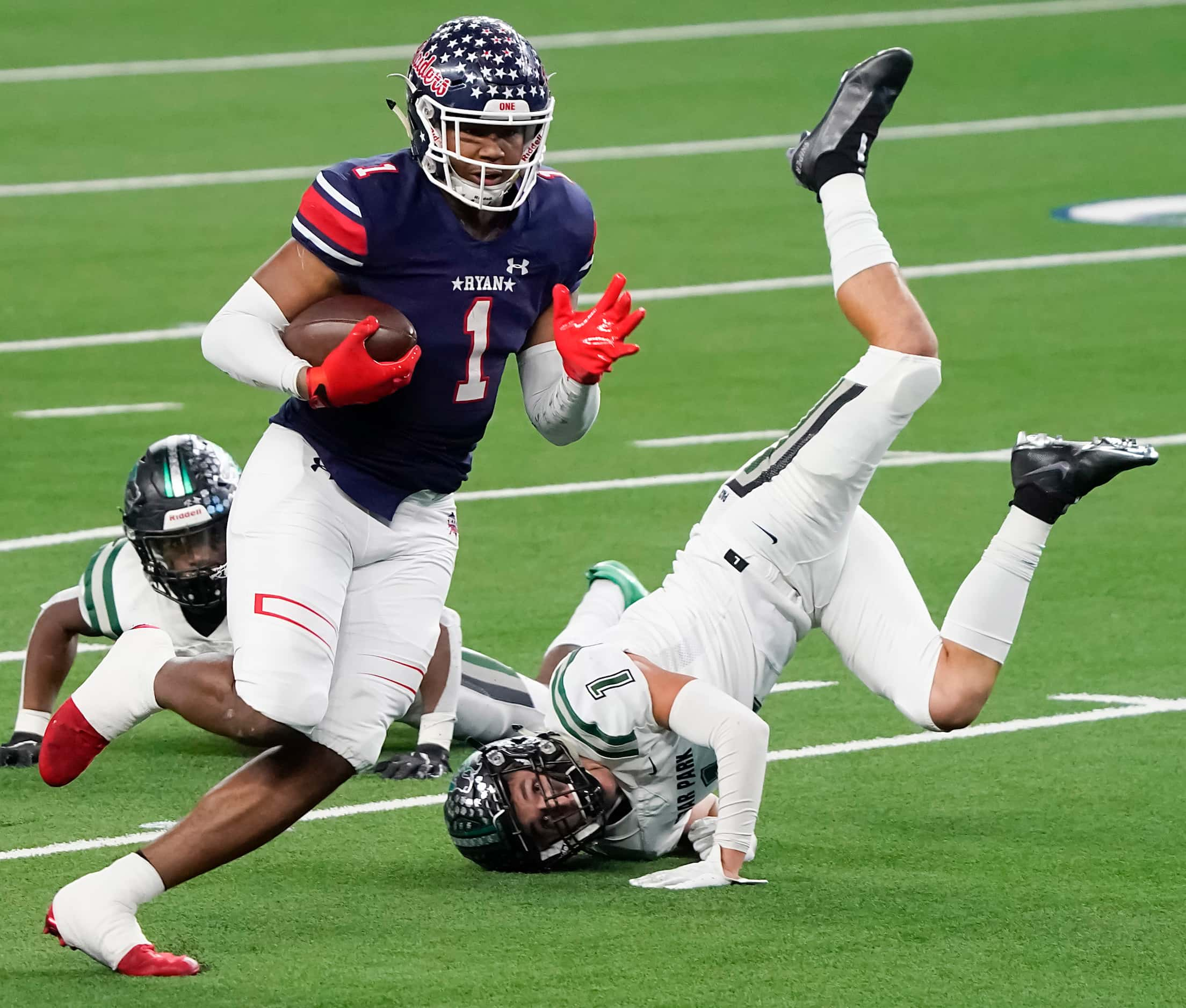 Denton Ryan wide receiver Ja'Tavion Sanders (1) tests past Cedar Park defensive back Cody...