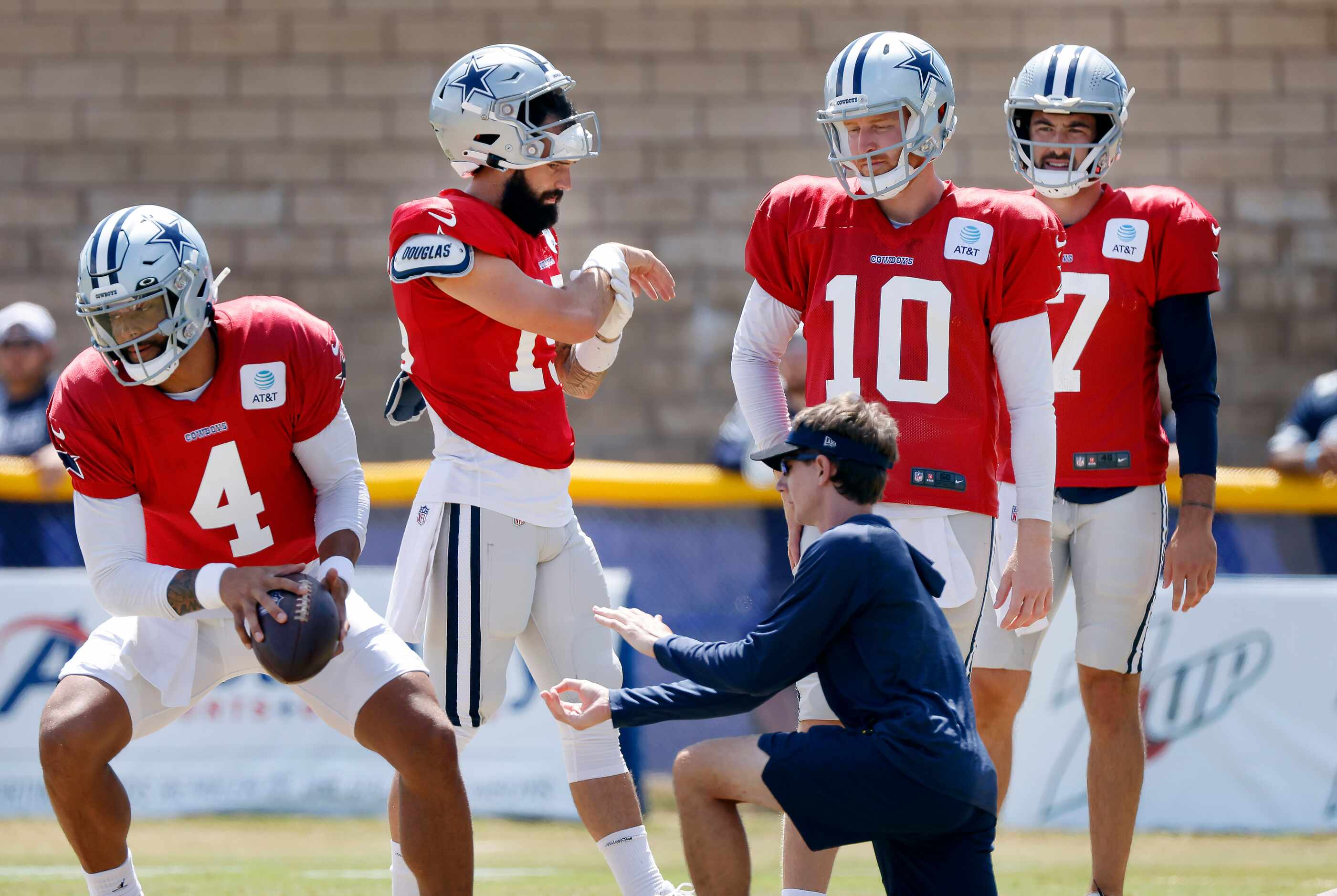 Dallas Cowboys backup quarterbacks (from right) Ben DiNucci (17), Cooper Rush (10) and Will...