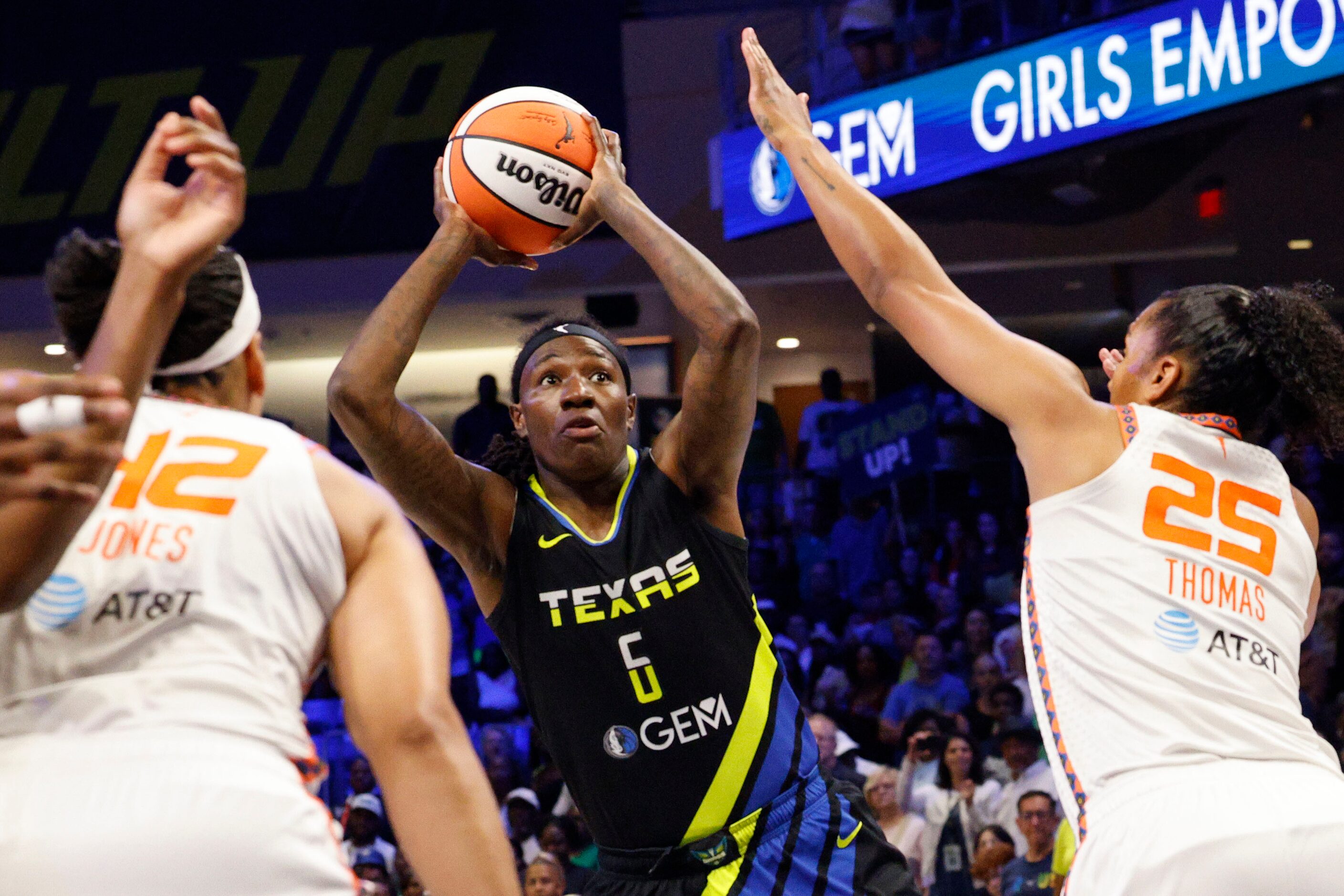 Dallas Wings forward Natasha Howard (6) tries to shoot over Connecticut Sun forward Brionna...