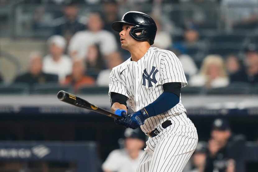 New York Yankees' Isiah Kiner-Falefa hits an RBI double during the seventh inning of a...