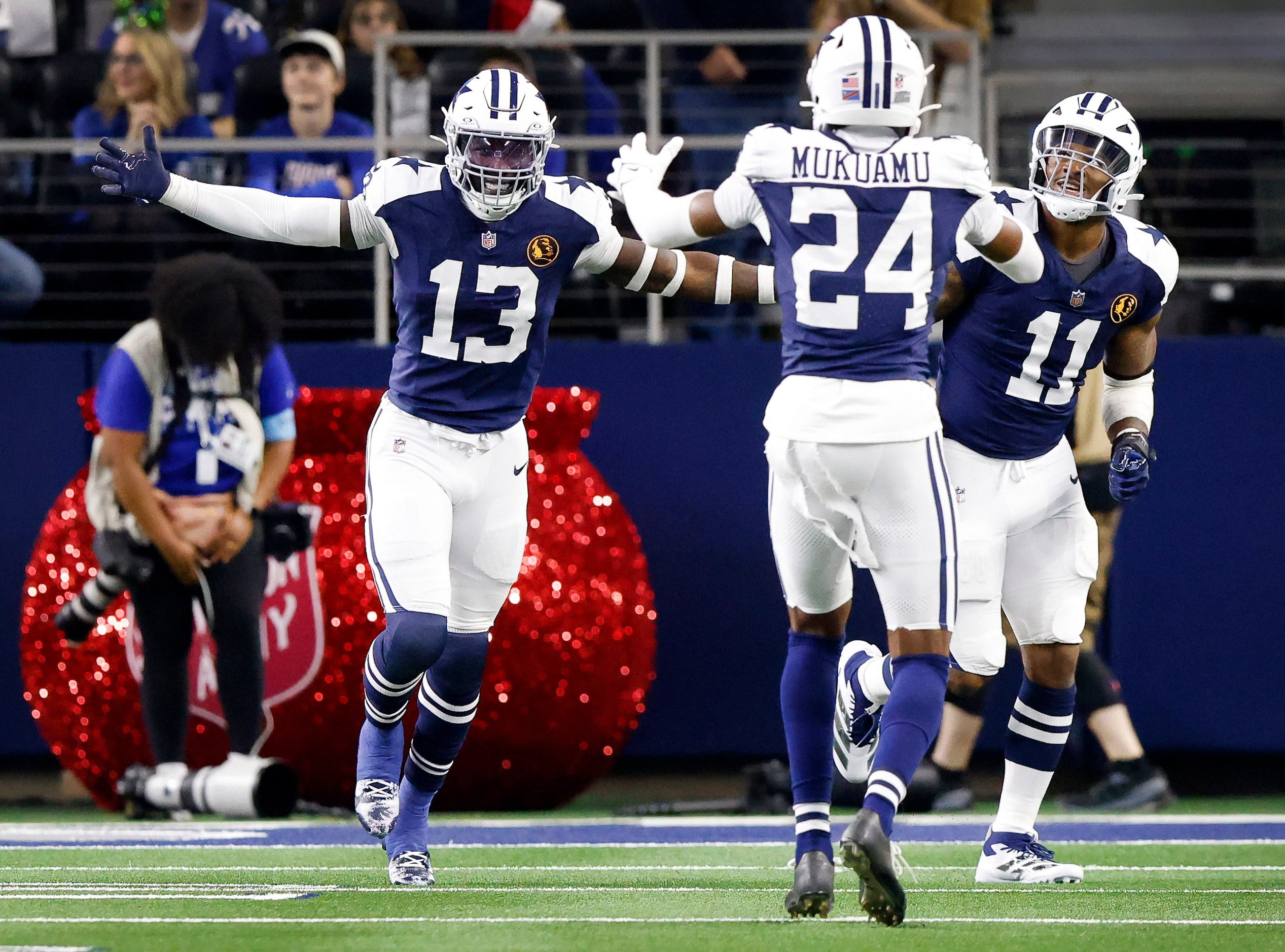 Dallas Cowboys linebacker DeMarvion Overshown (13) celebrates an interception he returned...