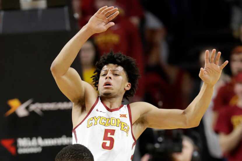 Iowa State guard Lindell Wigginton (5) is fouled by Baylor guard Manu Lecomte during the...