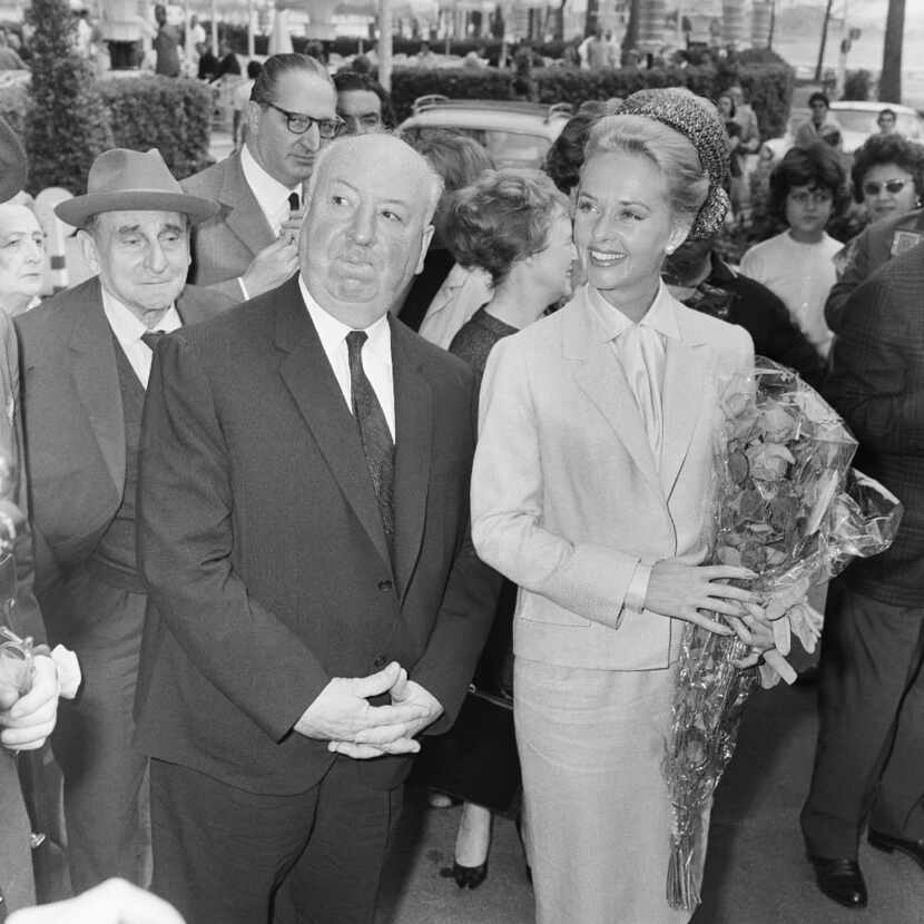 In this 1963 photo, director Alfred Hitchcock and actress Tippi Hedren arrive at the Carlton...