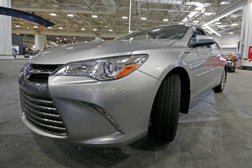 The 2017 Toyota Camry Hybrid XLE is parked inside the show floor to be placed for the DFW...