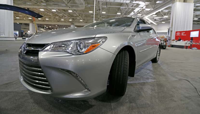 The 2017 Toyota Camry Hybrid XLE is parked inside the show floor to be placed for the DFW...