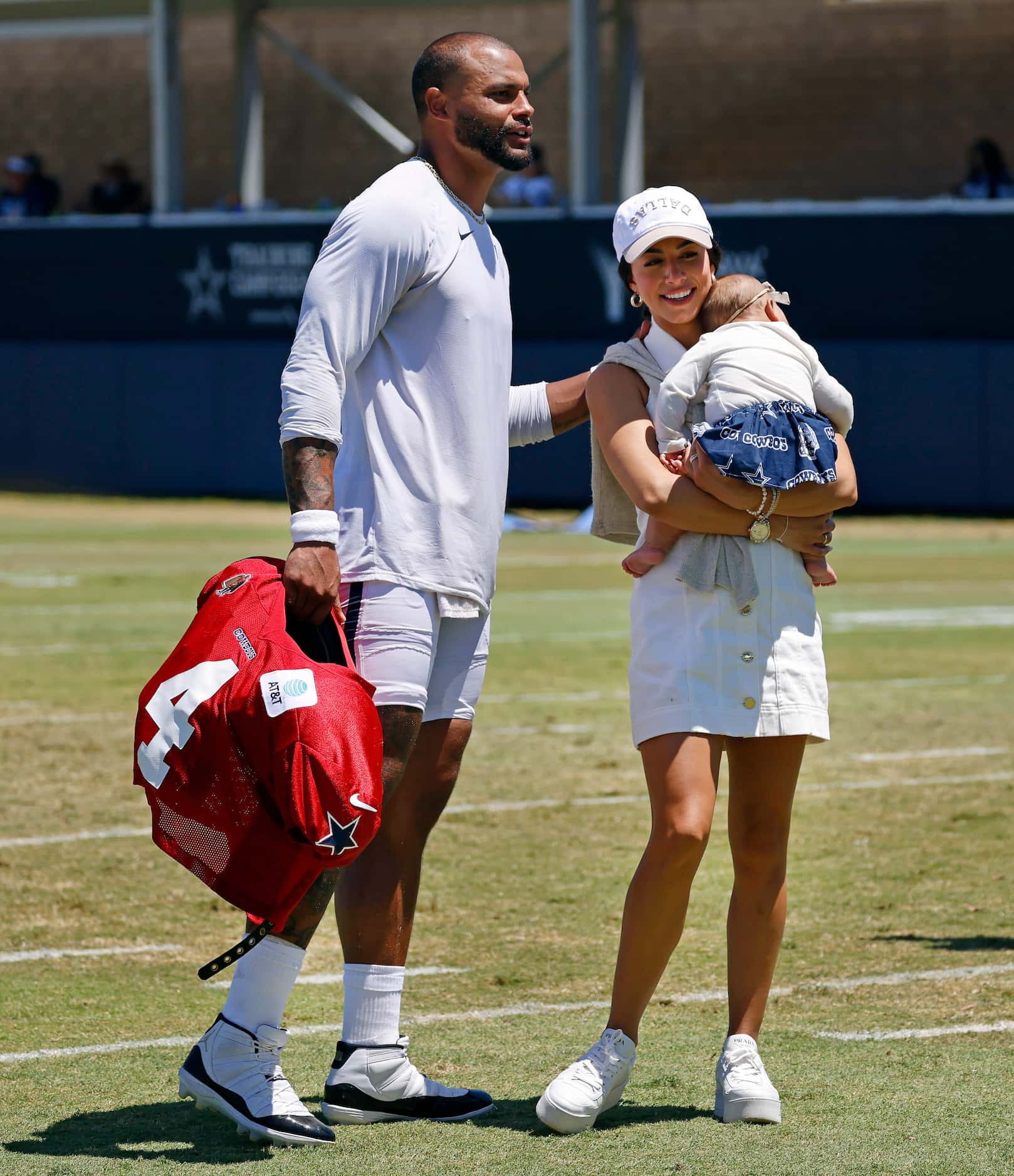 Dallas Cowboys quarterback Dak Prescott visits with his girlfriend Sarah Jane Ramos and...