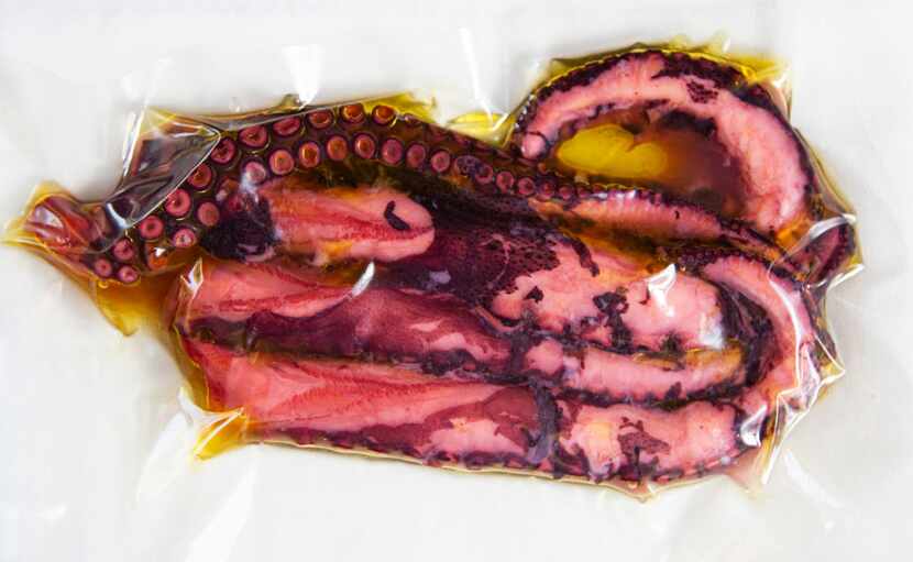 Octopus tentacles in a vacuum-sealed sous vide bag at Macellaio in the Bishop Arts district...