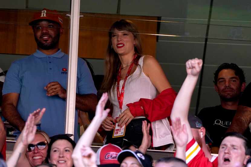 Taylor Swift watches from a suite inside Arrowhead Stadium during the first half of an NFL...