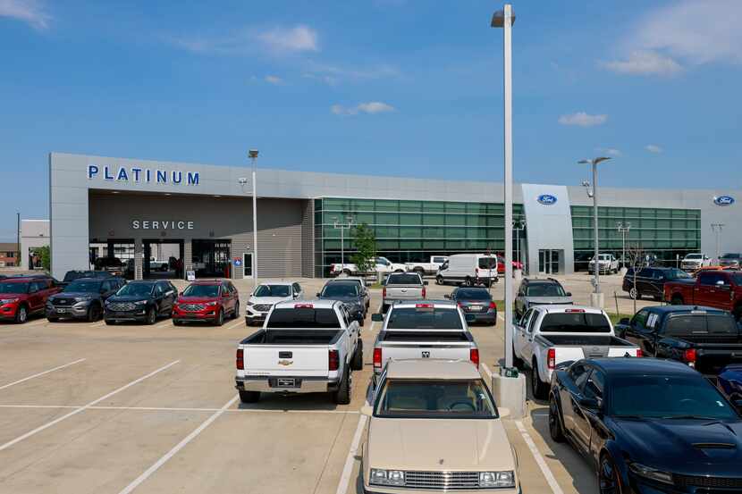 Pre-owned vehicles sit in a lot at Platinum Ford in Terrell.