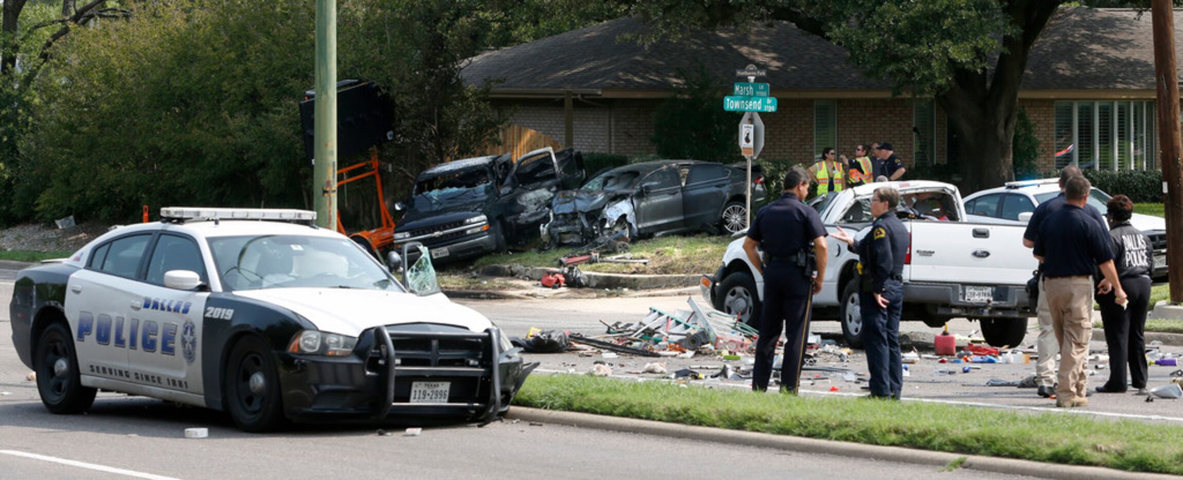 The crash scattered debris across Marsh Lane and spun cars into the yards of homes along the...