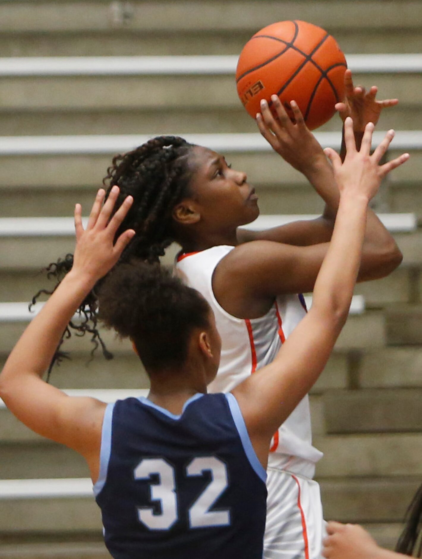 Arlington Bowie forward Aleyah Simmons (20) shoots over the defense of Hurst L.D. Bell...