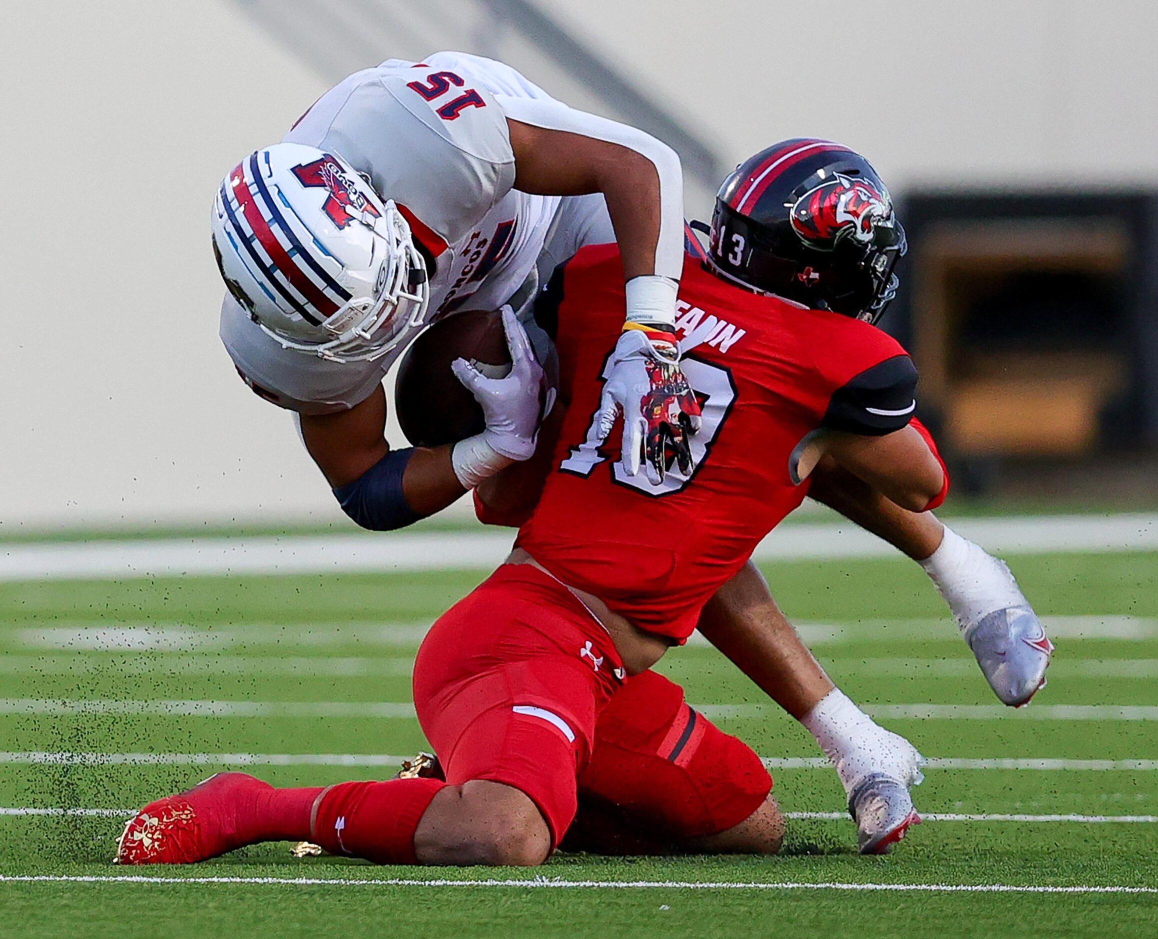 McKinney Boyd running back Carter Whitefield (15) is stopped by Denton Braswell linebacker...