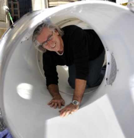  Ignaz Gorischek poses in a tube during installation of a 85-foot plastic tunnel in the...