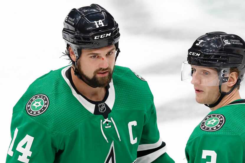 Dallas Stars left wing Jamie Benn (14) took a hit to the nose as he skates with defenseman...