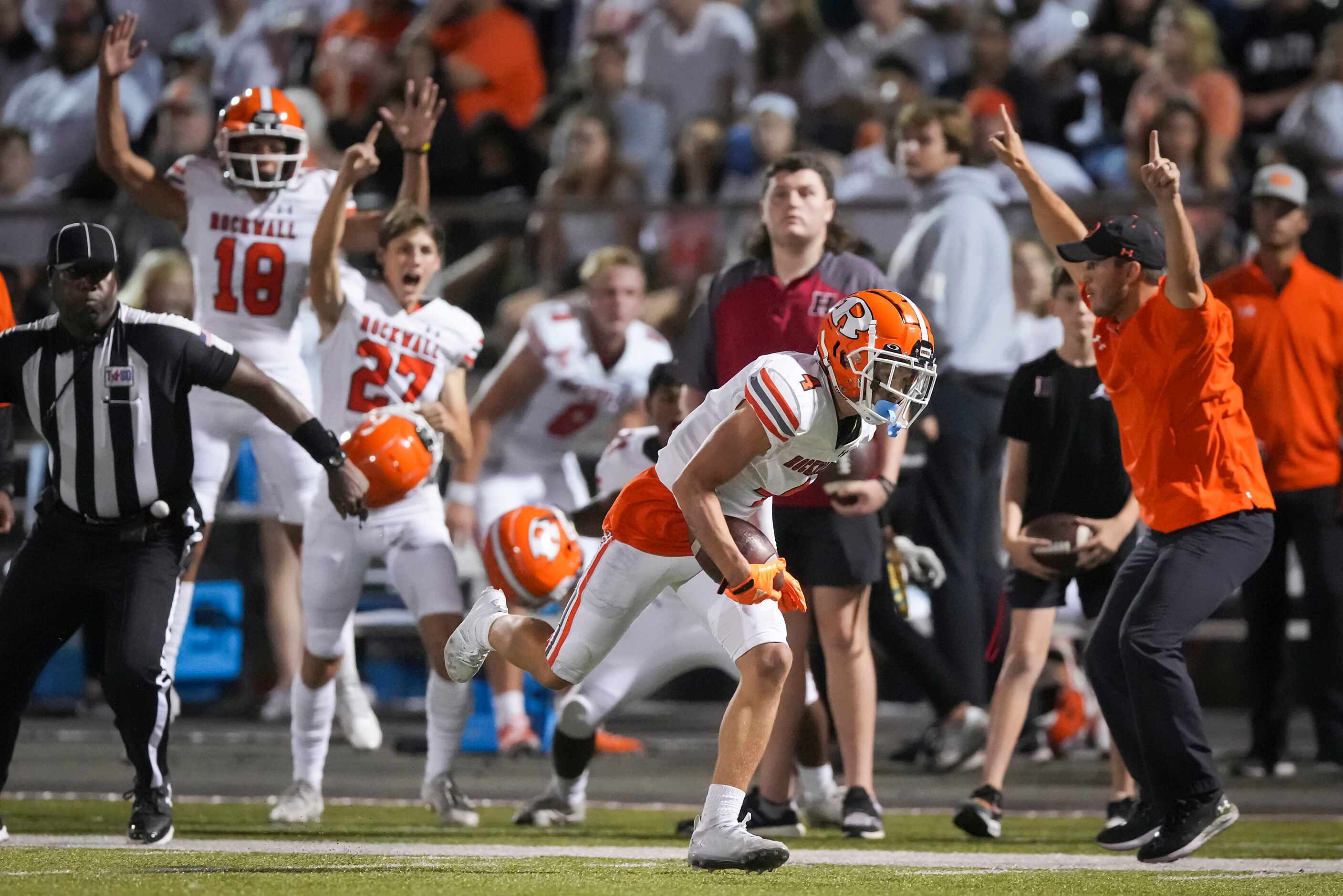 The Rockwall bench erupts as defensive back Tre Carter (4) recovers an onside kick during...