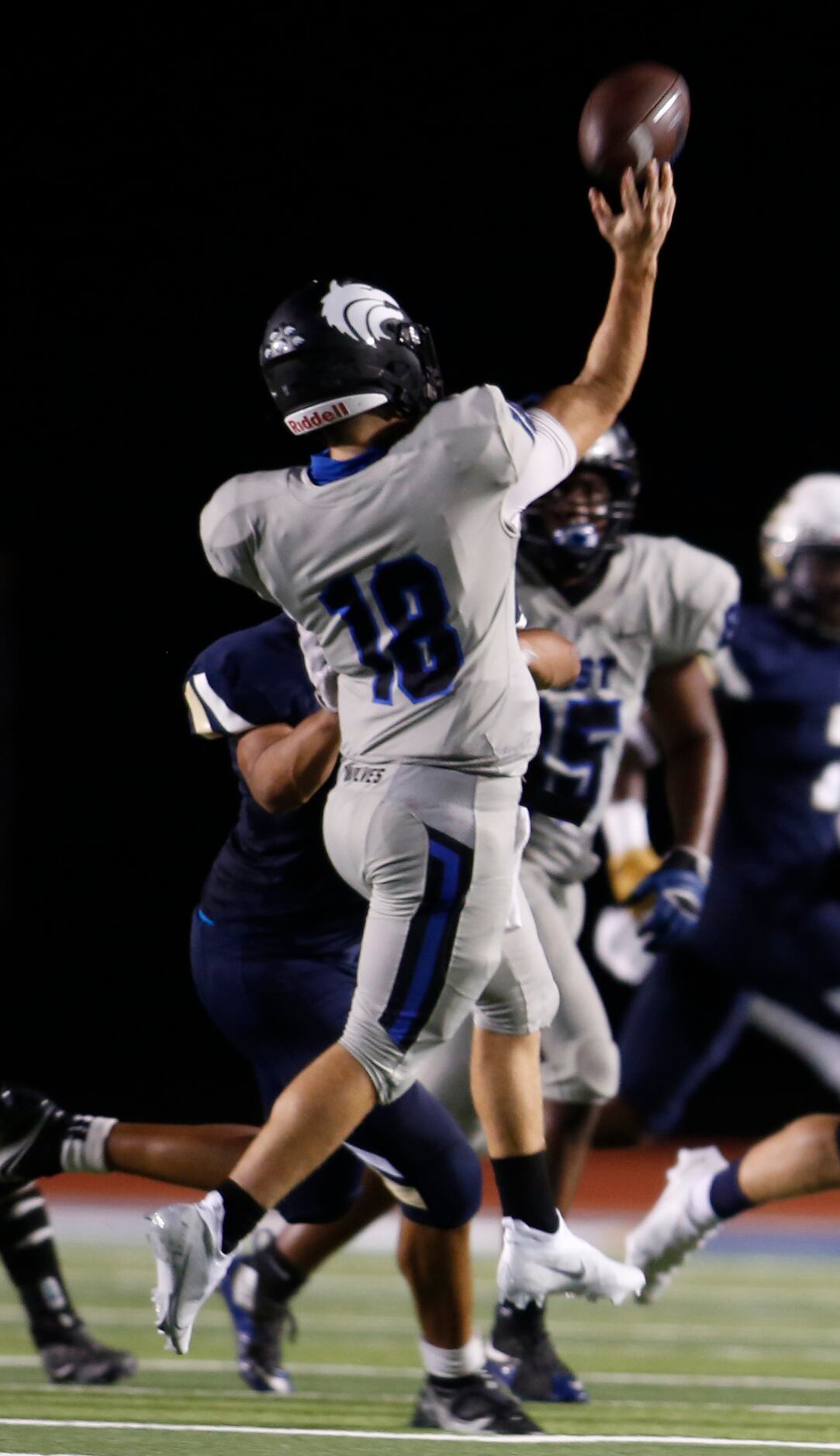 Plano West quarterback Greg Draughn (10) gets off a jump pass during first half action...