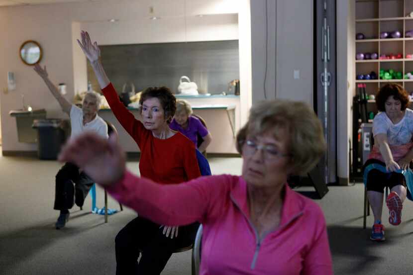 Wendy Ricks (left) and Gay Vanwart (right) practiced yoga with a group of senior citizens...