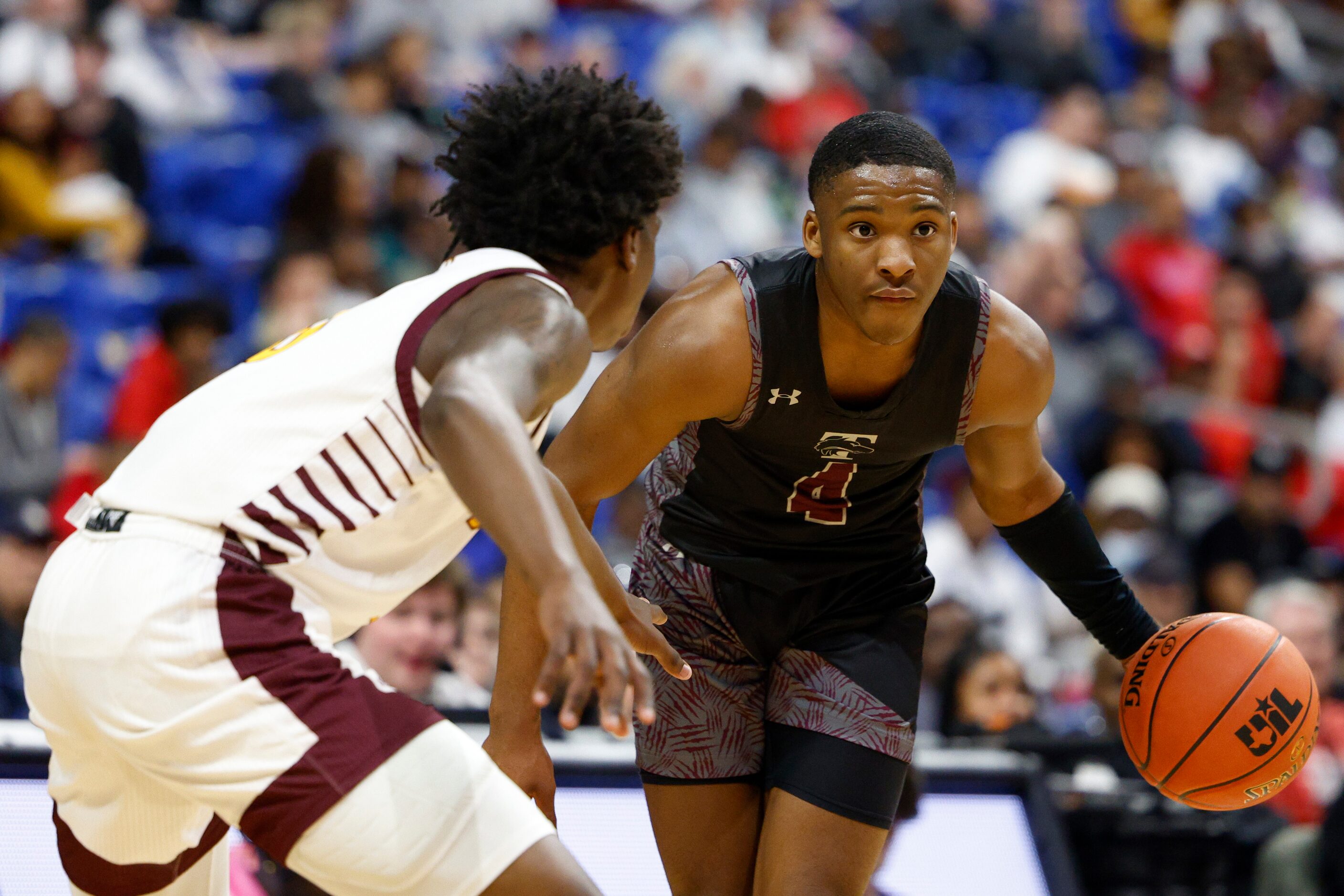 Mansfield Timberview guard Donovan O'Day (4) looks to drive the ball against Beaumont United...