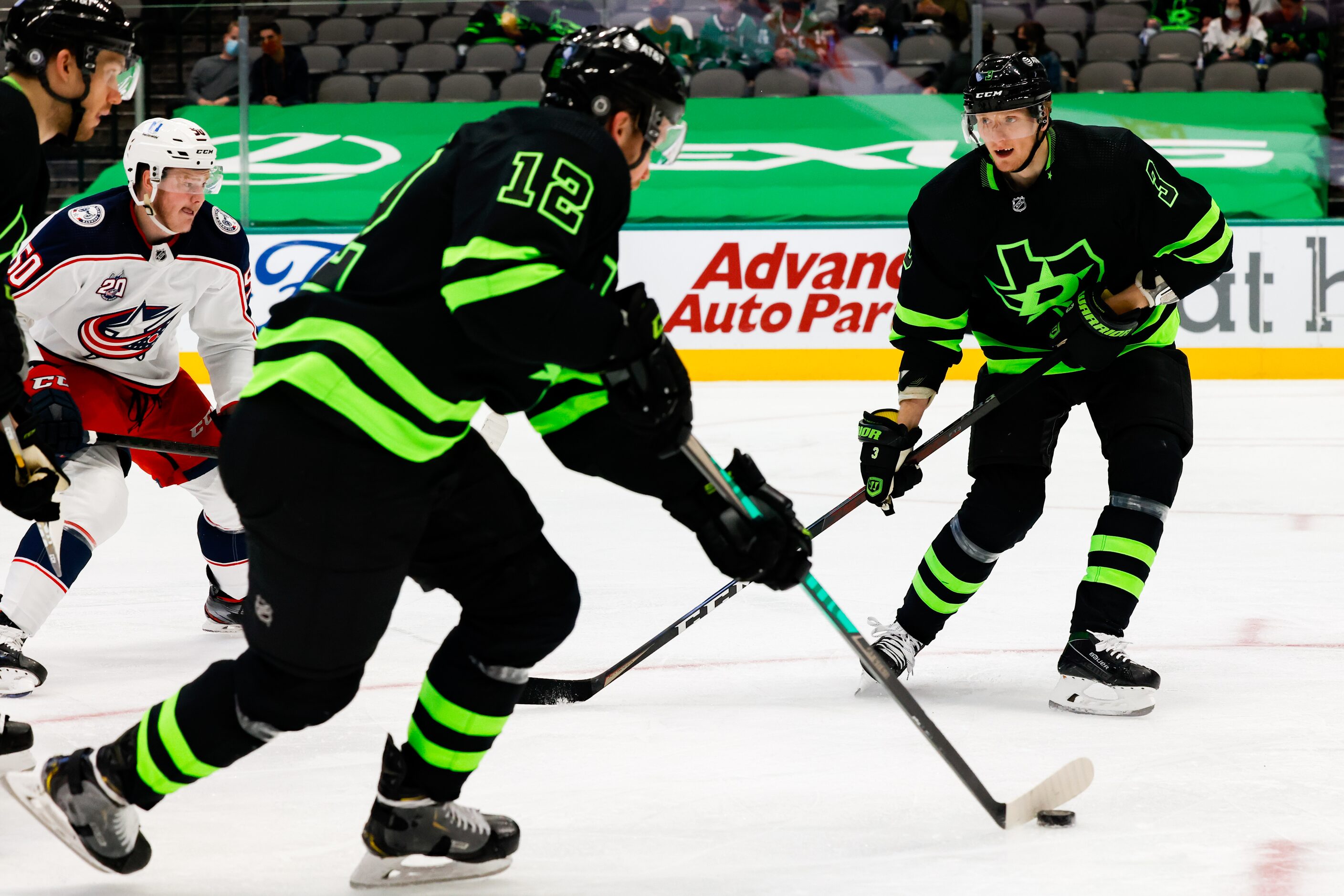 Dallas Stars center Radek Faksa (12) guides the puck as Dallas Stars defenseman John...