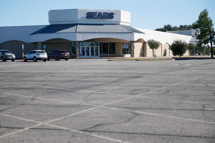 A few cars in the parking lot of a Sears at Richardson Square in Richardson, Texas on...