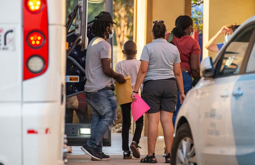 Volunteers with Faith Forward Dallas helped migrant families from Haiti and Cuba exit a bus...