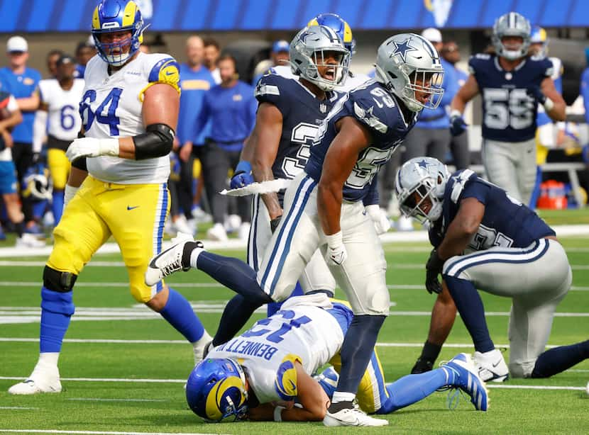 Dallas Cowboys linebacker Jason Johnson (53) celebrates his sack of Los Angeles Rams...