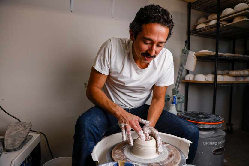 Ceramic artist Marcello Andres works with clay at his studio in Dallas.