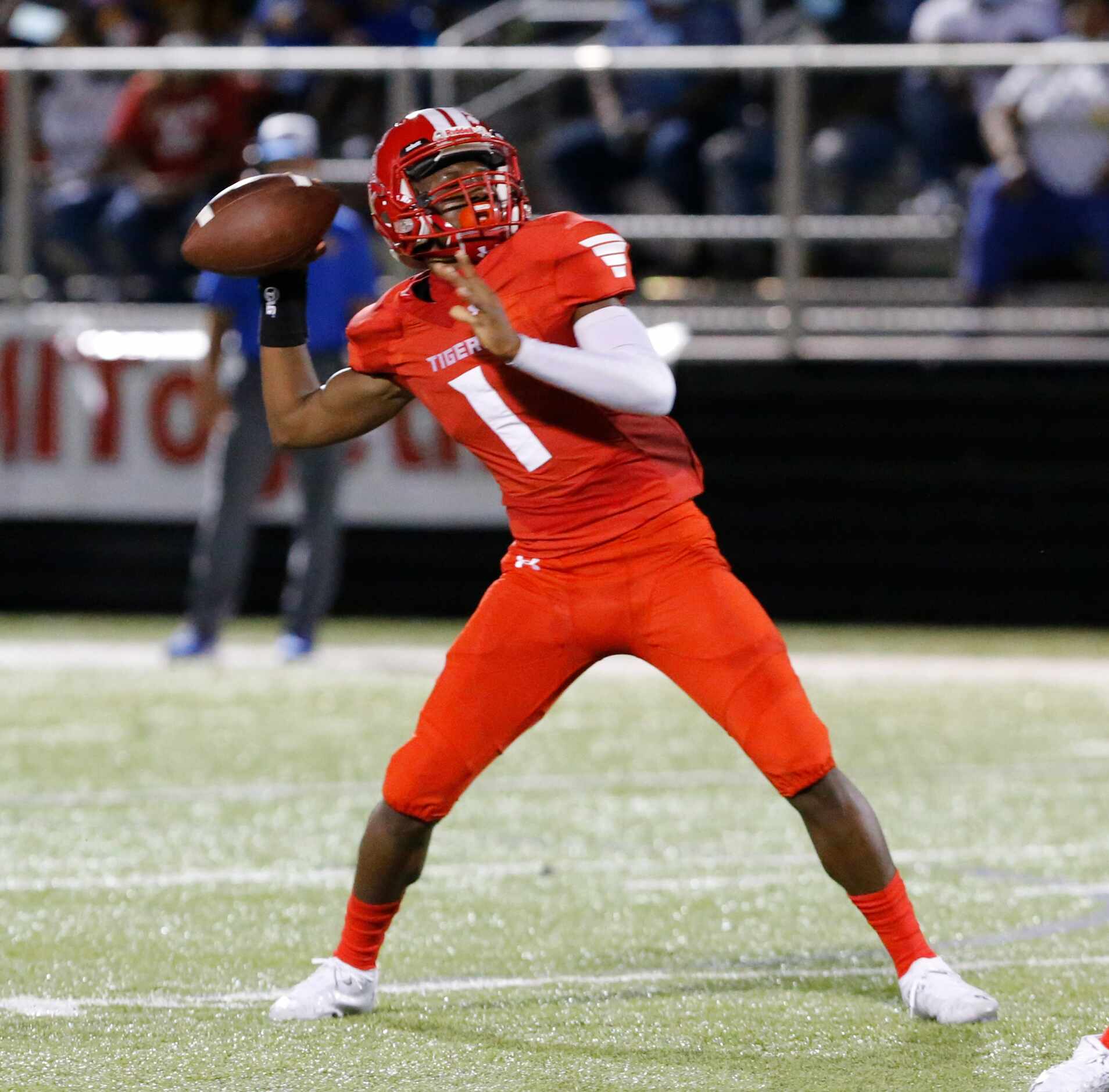 Terrell QB Kanye Nix (1) throws a pass during the first half of a high school football game...