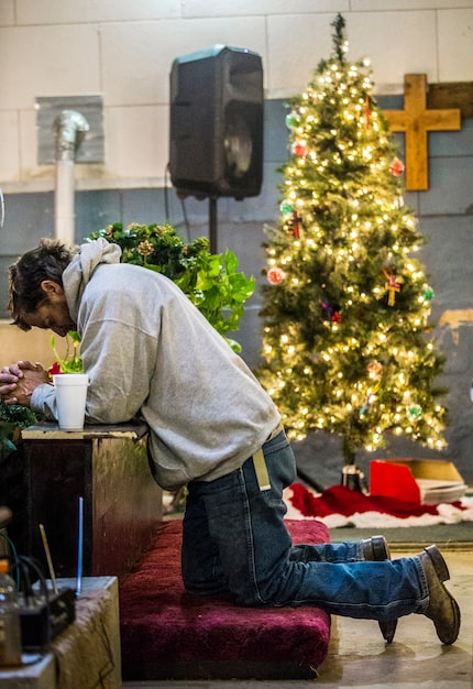 Jerry Andrews, of Friendship, Okla., prays after a service at Coke County Cowboy Church in...