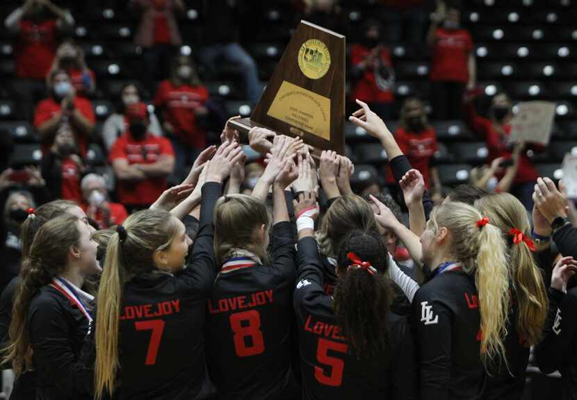 Lovejoy players hoist the state championship trophy in celebration after defeating Lamar...