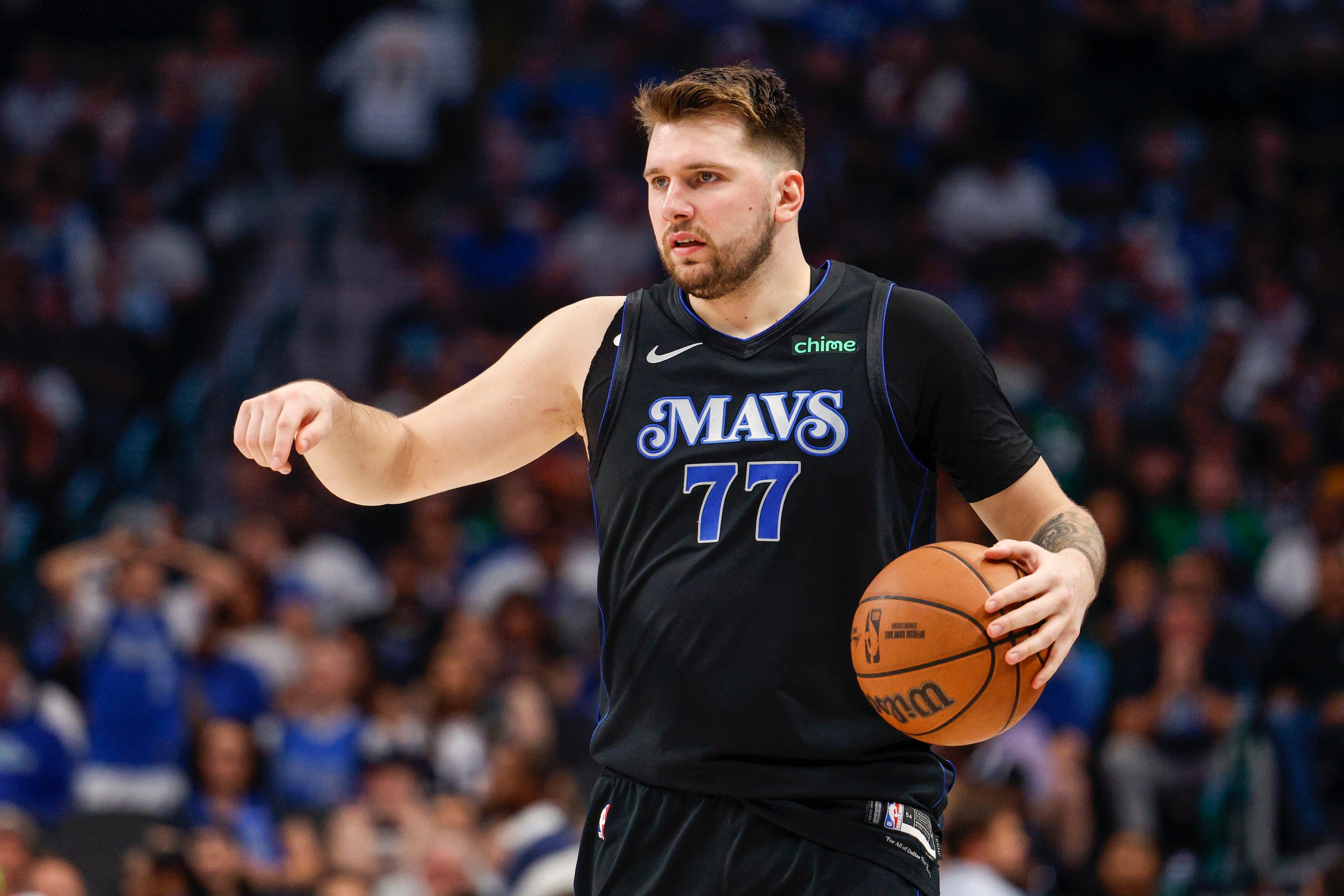 Dallas Mavericks guard Luka Doncic (77) dribbles the ball during the second half of Game 6...