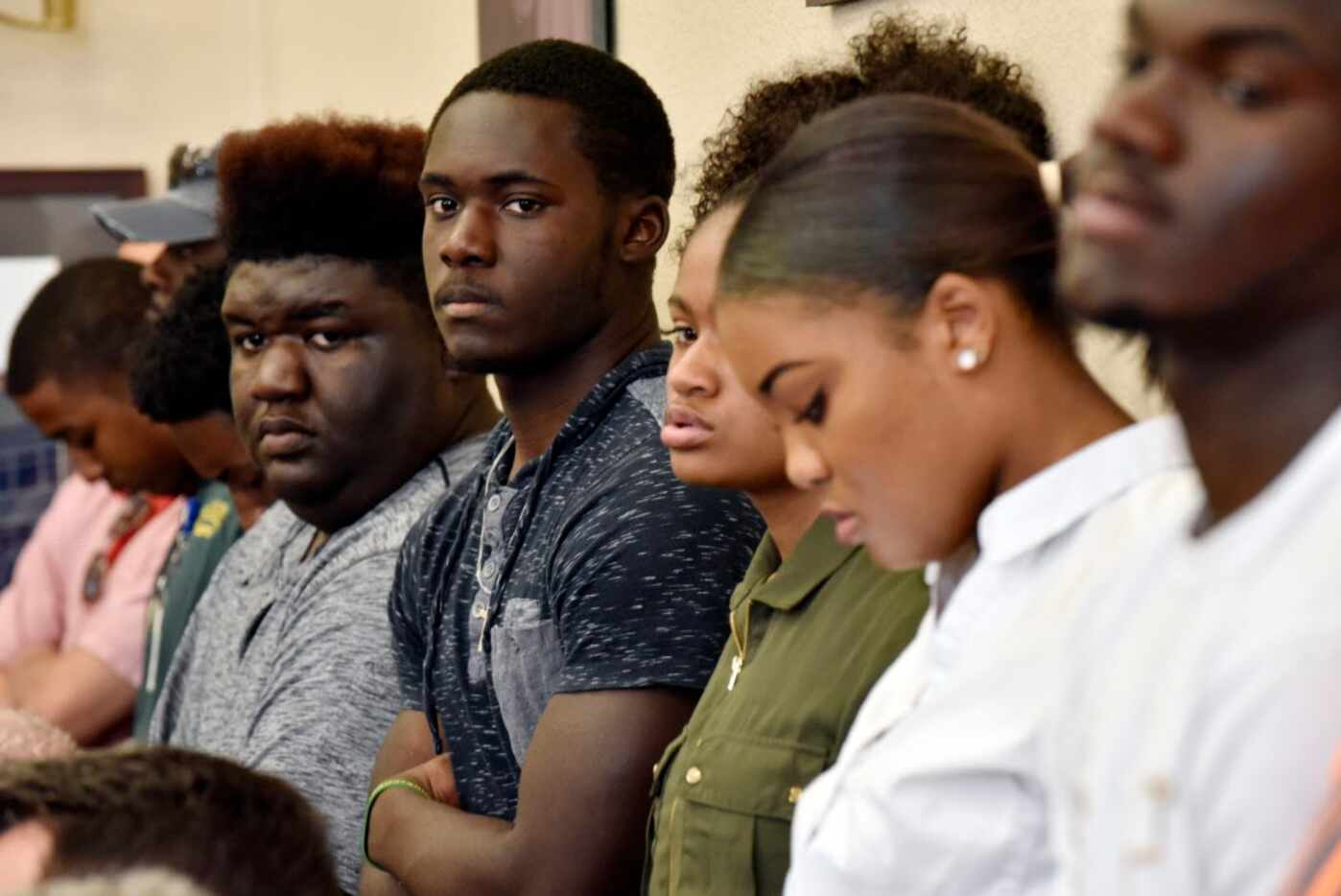 DeSoto high school football players Jaylin Sparks, far-left, and Jaylond Dorris, stand...