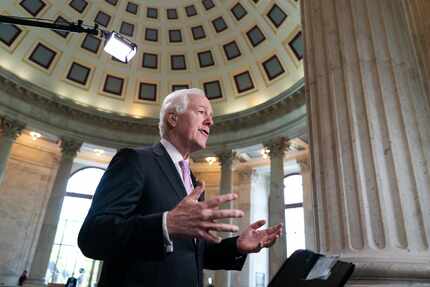 Majority Whip John Cornyn, R-Texas, takes questions during a TV news interview as the Senate...